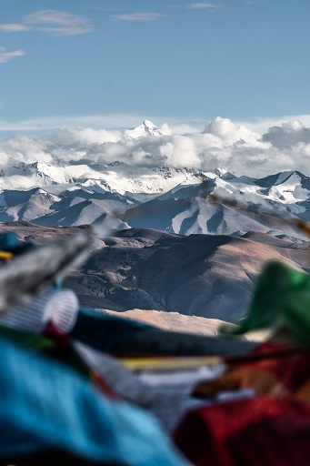 moutains with clouds around them, showing Himalaya in background